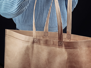 Nonwoven promotional bag manufacturing